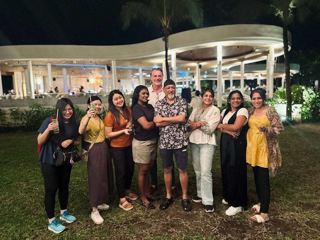 Basis Bay team gathered outdoors during an evening company event