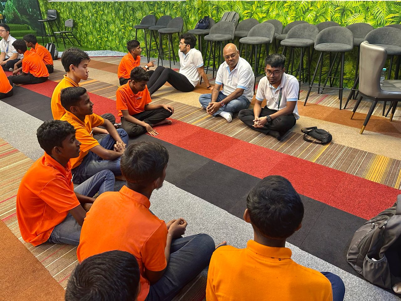 Basis Bay staff in a sharing circle with young trainees